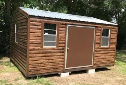 Wooden log cabin portable storage shed with metal roof and horizontal log siding